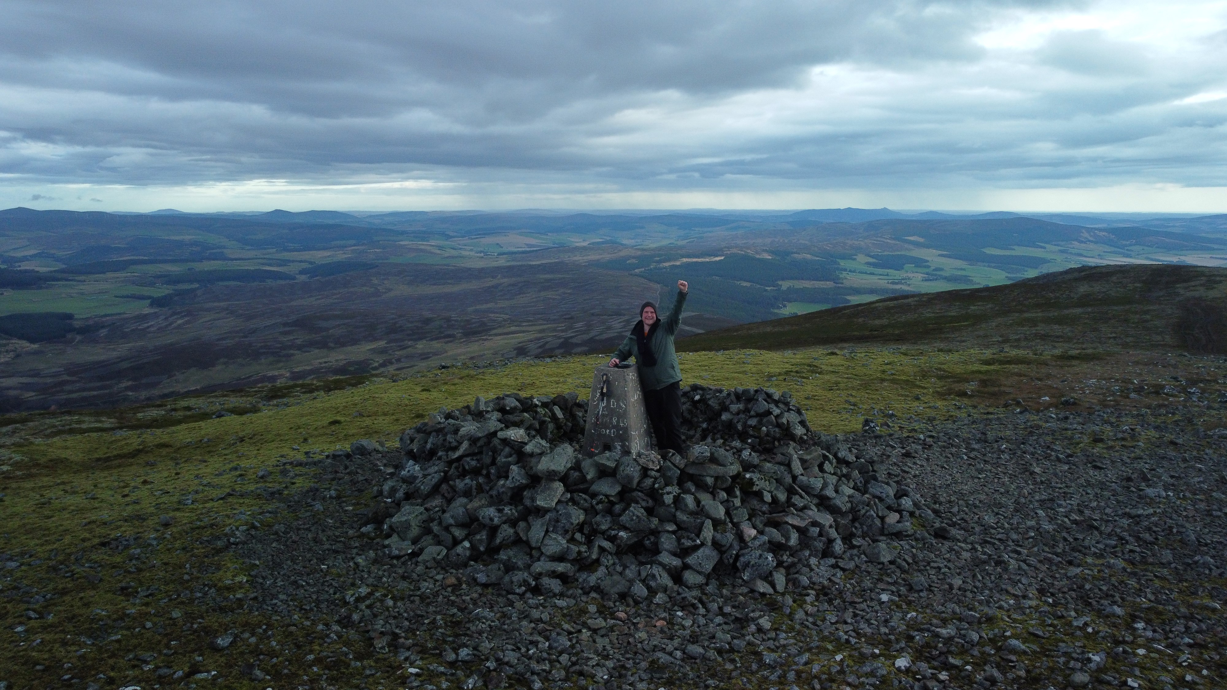 Jamie standing on a summit above the Aberdeenshire countryside