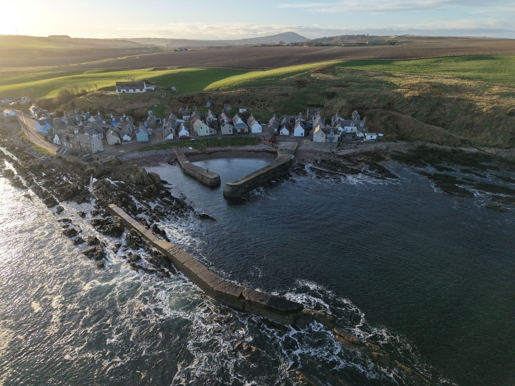 Aerial view of a small fishing village on the coast